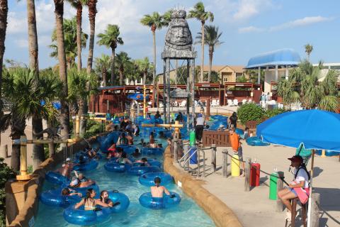 Families floating down lazy river at Moody Gardens